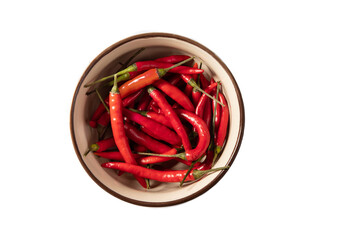 Red chilli peppers in a bowl on a white background.