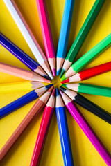 Naklejka premium Colored Pencils On A Yellow Background. Education