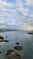 Genova, Italy - January 12, 2022 - Seascape, blue sky, clouds and sea in the tropical waters of the Mediterranean sea in winter days.