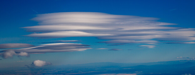 Fototapeta na wymiar Lenticular Clouds at 30,000 feet over the Oregon high desert.