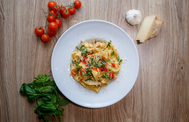 pappardelle pasta with chicken breast and red pepper top view