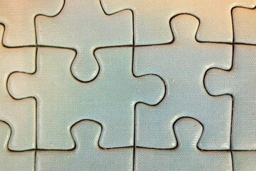 white puzzle pieces macro shot, jigsaw close-up
