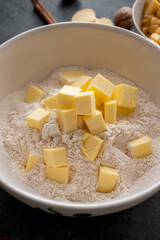 Baking pastry concept - mixing dough butter and flour. Cooking a desset, apple pie, cookies