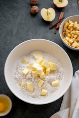 Baking pastry concept - mixing dough butter and flour. Cooking a desset, apple pie, cookies
