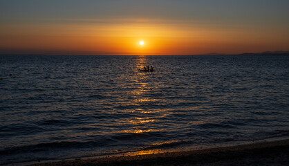 Obraz premium Tranquil scene of beautiful sea at sunset. Orange and yellow sunset on the sea. Aerial panoramic view of sunset over sea.