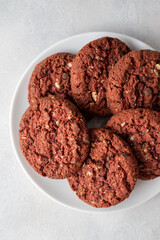 Oatmeal red velvet cookies nuts and seeds on bright background. Top view.