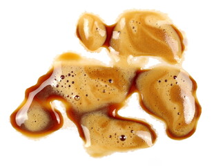 Spilled coffee espresso with foam, stains isolated on white background, top view