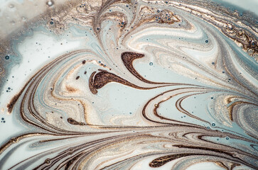 Marbleized effect. Natural Luxury. Liquid marble pattern with golden powder. Ancient oriental drawing technique.