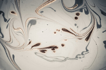 Marbleized effect. Natural Luxury. Liquid marble pattern with golden powder. Ancient oriental drawing technique.