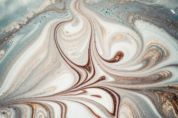 Marbleized effect. Natural Luxury. Liquid marble pattern with golden powder. Ancient oriental drawing technique.