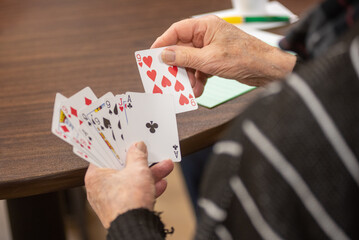 playing cards in hand