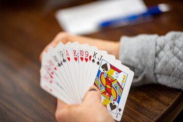 playing cards on the table of a hand