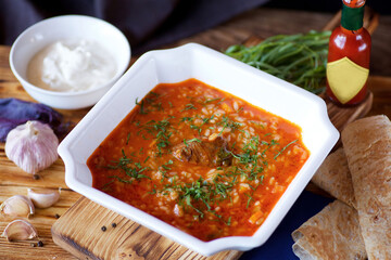 Delicious spicy hearty soup with meat and cereals.
