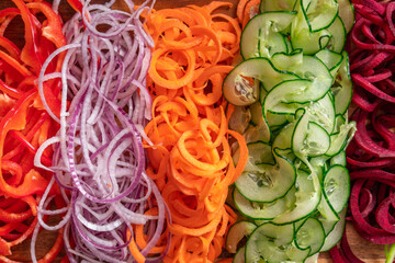 Food background. Vegetable spirals. Top view.