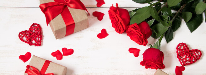 Gift boxes in craft paper with red ribbon. Eco style for valentine's day.