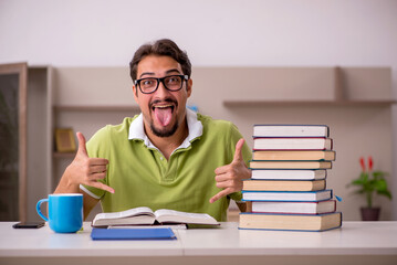 Young male student studying at home