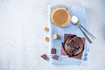 Chocolate cupcakes with dark chocolate slices and coffee drink