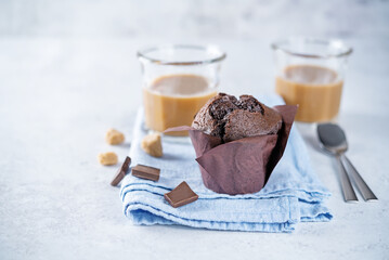 Chocolate cupcakes with dark chocolate slices and coffee drink