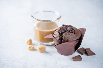Chocolate cupcakes with dark chocolate slices and coffee drink