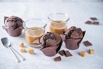 Chocolate cupcakes with dark chocolate slices and coffee drink