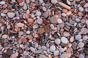 Stones of different shapes and different colors, seashore, Antalya, Turkey, January 2022, new year, background, screensaver.
