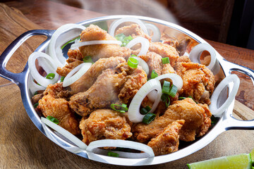 Fried chicken served in aluminum pan