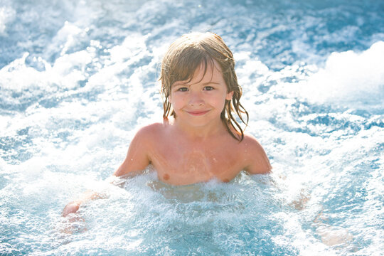 Cute boy swim in pool. Active healthy kids lifestyle, water sport activity and lessons for summer family vacation with child.