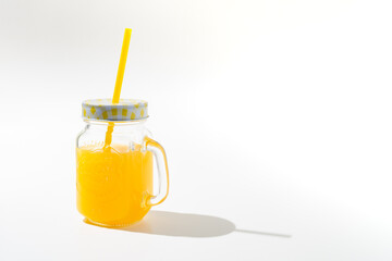 Orange juice glass bottle. Isolated on white background