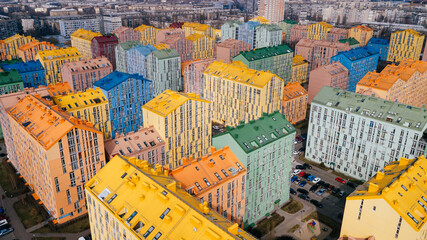 aerial view of colorful (red, green, blue, yellow) buildings on city street. drone shot