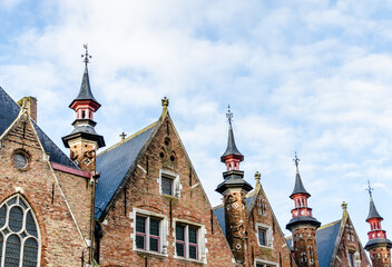 Fototapeta premium Bruges, Belgium; view of the medieval buildings that are crossed by the canals of the city. Historic center World Heritage