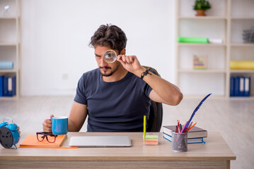 Young male designer working in the office