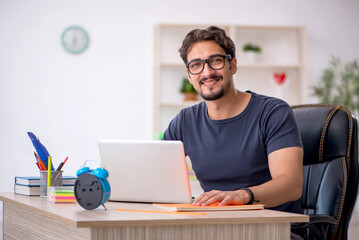 Young male designer working in the office