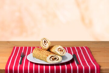 Traditional Christmas dessert, cake with vanilla cream on the desk