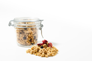 The granola breakfast cereals in jar isolated on white background
