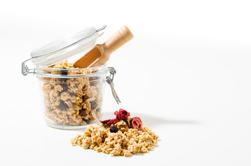 The granola breakfast cereals in jar isolated on white background
