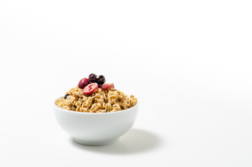 Granola in bowl on white background
