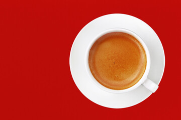 Obraz na płótnie Canvas Full cup of espresso coffee on red