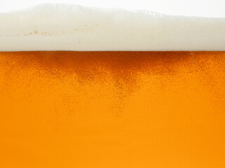 Close up background of beer with bubbles in glass