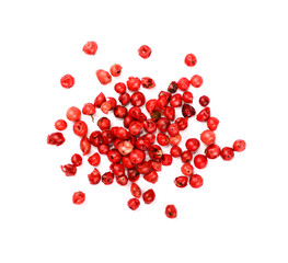 Heap of red pink peppercorns isolated