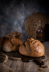 Fresh wheat bread on a wooden rustic table