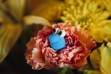 blue goober on flowers character 