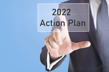 Businessman touching virtual screen 2022 action plan