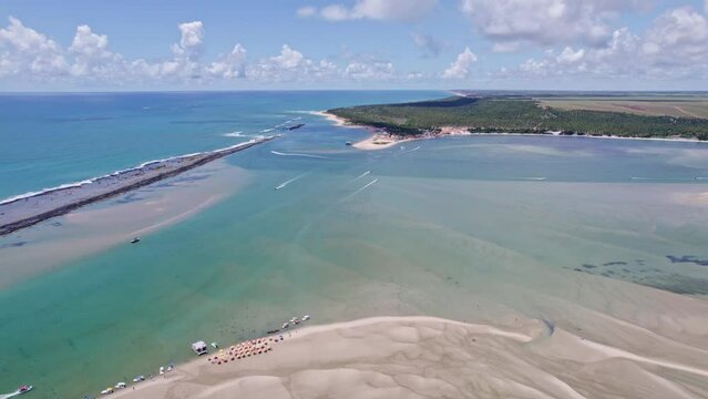 Aerial view of Gunga Beach or "Praia do Gunga", with its clear waters and coconut trees, Maceio, Alagoas. Northeast region of Brazil. 4K