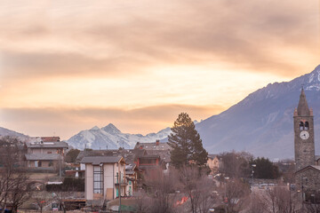 countryside panorama at sunset with sky colored in purple and red shades