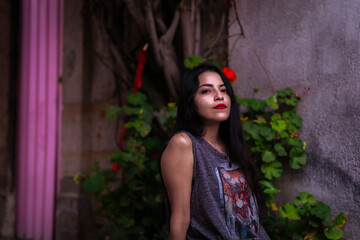 Street photoshoot with a beautiful young girl with red lips and long hair