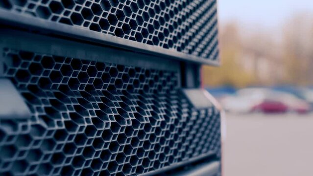 Close-up view of cargo truck radiator grille. Beautiful pattern of modern radiator grille