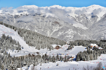 Fototapeta na wymiar snow covered mountains in Courchevel ski resort French alps