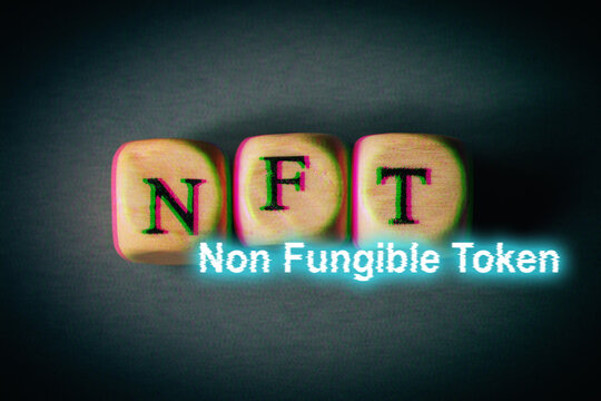 NFT non fungible token - text with glitch effect. Modern business crypto art and digital currency concept.