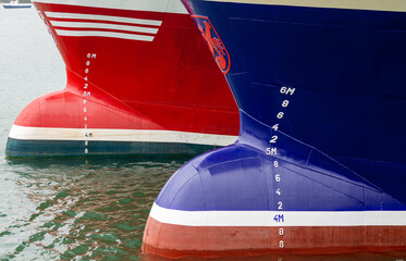 Blue and Red bow of boats showing draught marks - obrazy, fototapety, plakaty