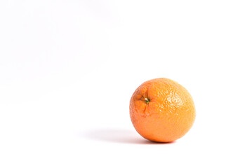 Ripe orange on a white background frontal shot